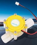 Yellow Micro Hydroelectric DC Turbine Generator for Off Grid Power, 12V Output, compact design with connectors visible