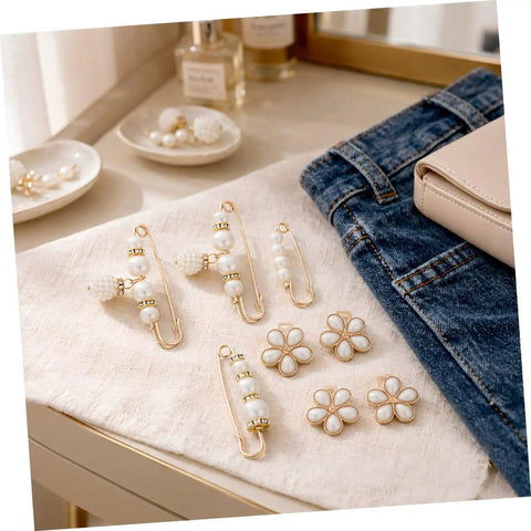 Eight Piece Pearl Waist Tightener Pin Set Elegant Alloy Dress Cincher Clips on a table with denim and accessories.