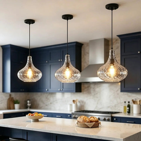 WILON 11" Hammered Glass Pendant Lights Kitchen Island Black hanging above a kitchen island with modern décor and food items.