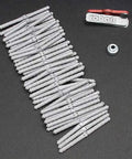 Three Sixteenth Inch Steel Pin Super Hinge Point Big Bag Combo With Fifty Pins Drill Jig And How To Guide For Model Airplane Hardware And Linkages Ideal For RC Plane Repairs And Builds. steel hinge pins, drill jig, and guide laid out on black background