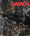 Person aiming Dual Mode Break Barrel Air Rifle With Semi Auto And Full Auto Fire 1300 FPS .22 Caliber in outdoor setting
