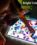 Kid using Magnetic Bingo Set With 100 Orange Plastic Markers For Math Counting And Science Exploration Kid Friendly STEM Kit.