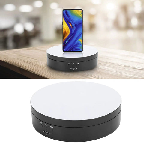 Spiffy Omquot Electric Rotating Jewelry Stand With 360 Degree Swivel Plate And Usb Charging Port For Watches Cosmetics And Toys In Sleek Black Finish, ABS material with a white top and controls, showcasing a phone.