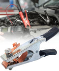 Heavy Duty 500A Welding Ground Clamp With Rubber Sleeve And Insulated Handle in use during car engine repair