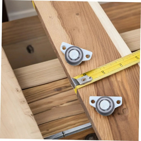 Set Of Four Heavy Duty Adjustable Sliding Door Rollers With Precision Bearings Buttery Smooth Glide Easy Side Or Vertical Mounting On Closets Barn Doors on wood with measuring tape.