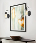 Rayne 9.5 Inch Modern Farmhouse Wall Sconce Black Gooseneck Light With Tapered Seeded Glass Shade in hallway