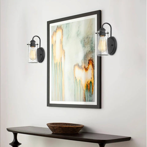 Rayne 9.5 Inch Modern Farmhouse Wall Sconce Black Gooseneck Light With Tapered Seeded Glass Shade in hallway