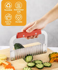Heavy Duty Crinkle Cutter For Potatoes And Veggies Stainless Steel With Wooden Handle Rust Resistant Wavy Knife in use on cucumber