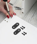 Installing Heavy Duty Black Iron Corner Brackets 20 Pack For Shelves And Partitions with screws on white panel