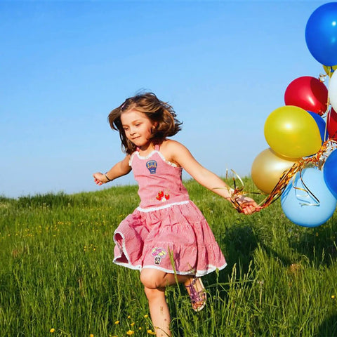 Girl in pink dress with 13 Piece Hot Air Balloon Iron On Patches Set With Colorful Embroidered Appliques For Clothes