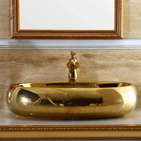 Top Shelf Ceramic Vessel Sink With Faucet Oval Countertop Wash Basin in shiny gold finish, ideal for bath remodels.