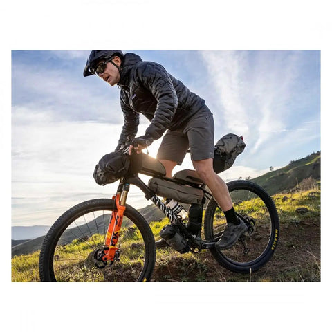 Cyclist on mountain bike with Green 4.5L Bike Frame Bag With Water Resistant Poly Nylon Build Easy Access Pocket Secure Hook And Loop Mounting
