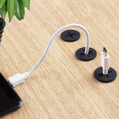 Premium Flexible Silicone Cable Cord Grommet Set 1 Inch Black with white USB-C cable on wood desk for wire management.