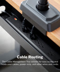 Under Desk Cable Management Tray For Sit Stand Desks, black tray holding cables and power strip under a wooden desk.