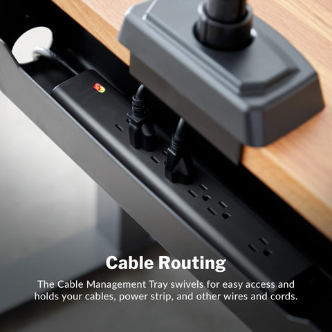 Under Desk Cable Management Tray For Sit Stand Desks, black tray holding cables and power strip under a wooden desk.