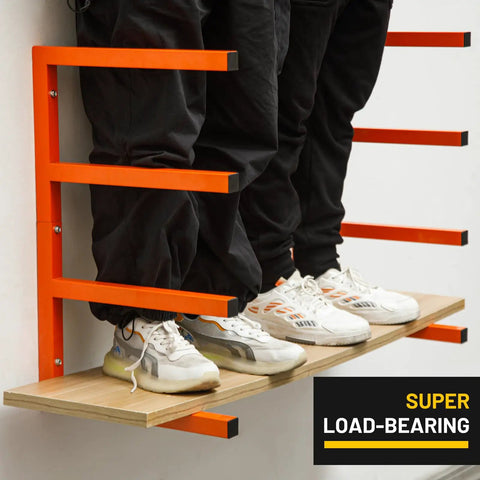 Heavy Duty Wall Mount Lumber Rack Solid Steel Wood Organizer Four Tier Garage Storage Shelf Handles Eight Hundred Pounds mounted on wall with support beams and wooden shelf.
