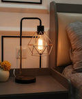 Set Of 2 Touch Control Black And Gold Desk Lamps With 2 USB Ports, Industrial Cage Style Bedside Reading Lamps lit on nightstand