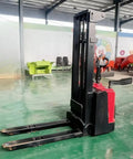 Heavy Duty Electric Cargo Lifting Stacker 1000kg To 3000 Kg Capacity 3 Meter Lift Height Straddle Leg Design in warehouse