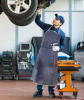 Mechanic wearing Pro Grade Cowhide Welding Apron Heat Resistant Shield For Sparks And Splatter in workshop