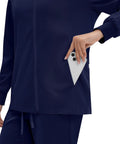 Women Go To Zip Front Scrub Jacket Four Pocket Medical Top Ultra Soft Stretch Uniform Coat with phone in pocket.