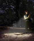 Person using Pro LED 2 Cell AA Flashlight With 332 Lumens Water Resistant Adjustable Focus in a wooded area at night