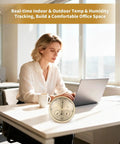 Three In One All Season Weather Station With Thermometer Barometer Hygrometer indoors with person using laptop at desk.