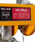 Close-up of Yellow Heavy Duty 440 Lb Electric Hoist And Winch Kit With Remote Control 120V Lift System, showing label and steel cable.