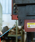 High Visibility PVC Safety Warning Stickers For Machinery And Equipment Self Adhesive Decals in factory setting.