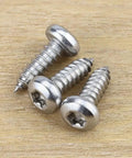 Number 12 By Three Quarter Inch Pan Head Torx Self Tapping Screws Made From 304 Stainless Steel on wood background