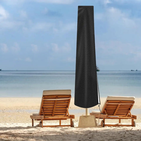 Tough As Nails Waterproof Patio Umbrella Cover With Rod For 7 To 11 Ft Outdoor Umbrellas on beach with two lounge chairs.