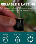 KUVRD Waterbear single patch universal screen cleaner, black square cleaning patch being rinsed under a faucet.