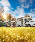 Family camping with Forest Green 5 Panel Wind Privacy Screen Windbreaker beside RV in grassy field, sunny day