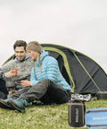 Two people camping with All Season Sleeping Bag for Adults and Kids, Lightweight Yet Warm Cold Weather Camping Gear in front of a tent