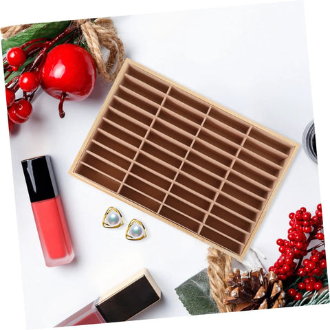 Wooden Multi Grid Ring Holder Tray on a white surface, ideal for storing jewelry and functioning as a cell phone stand.