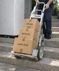Dual Handle Stair Climbing Hand Truck With 500 Pound Capacity Aluminum Dolly For Heavy Appliances And Furniture in use on stairs