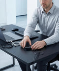 Premium Black Desk Grommets 2 Inch 10 Pack With Cable Management Kit installed on a sleek black desk managing wires