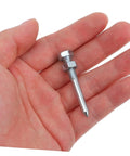 Hand holding a metal spike from Beefed Up Aerator Shoes Spikes For Women 20 Pack Turf Spikes For Lawn Aeration Metal Lawn Shoes Pegs