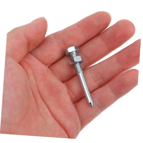 Hand holding a metal spike from Beefed Up Aerator Shoes Spikes For Women 20 Pack Turf Spikes For Lawn Aeration Metal Lawn Shoes Pegs