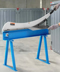Beefy Hand Plate Shear 31.5 Inch Max Cutting Length Manual Sheet Metal Cutter with T10 high hardness blades shown in a workshop setting