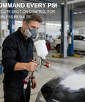 Person using air compressor regulator and flow control valve with pressure gauge and oil water separator for spray gun painting