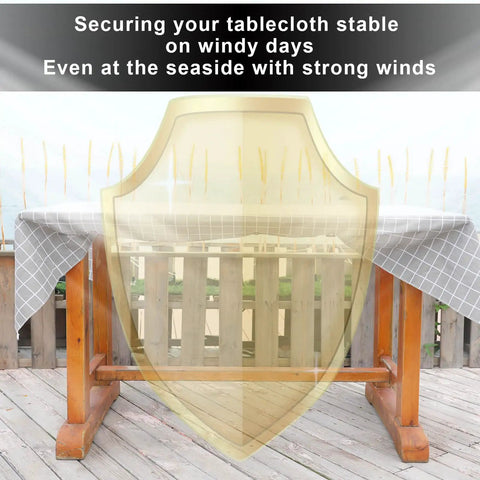 Outdoor table with shield illustration showing Hidden Strap Tablecloth Clips For Windy Picnics And Thick Indoor Outdoor Tables Invisible Design Keeps Your Tablecloth Secure Without Visible Clips On Any Surface.