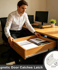 Man at desk using drawer with Ultra Thin Magnetic Door Catch 2 Pack No Drill Self Adhesive Invisible Cabinet Latch For Doors And Drawers Hidden Closet Magnet Closer Easy Install Strong Hold Keeps Cabinets Quiet And Closed.