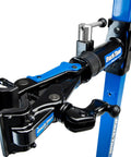 Close-up of Mechanical Lift Bicycle Repair Stand For E Bikes, Cargo Bikes, And MTB, 120 Lb Capacity, blue metal clamp.