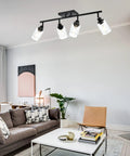 Living room with 4 Light Track Lighting Kit Matte Black With Pivoting Heads, 28.7-Inch Ceiling Spotlight Fixture, clear glass shades