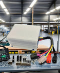Heavy Duty 96 To 24 Volt Isolated DC Converter 500 Watt Automotive Power Supply for Electric Vehicles in workshop setting.