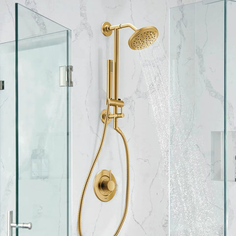Brushed Gold Modern Shower Arm Flange With LifeShine Non Tarnish Finish, wall-mounted in a contemporary glass shower enclosure