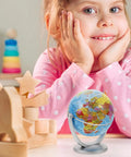 Blue World Globe With Smooth Rotation And Stable Stand For Classroom Office And Home Decor, next to smiling child at desk