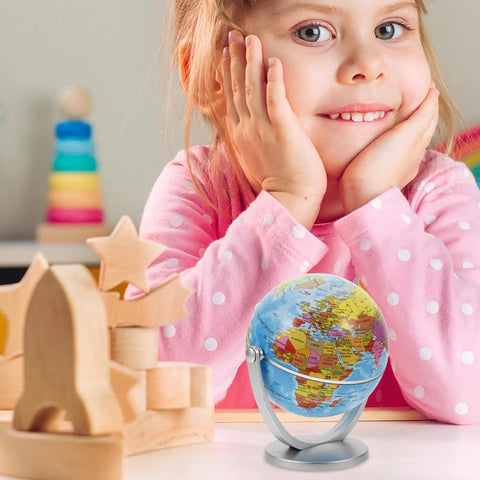 Blue World Globe With Smooth Rotation And Stable Stand For Classroom Office And Home Decor, next to smiling child at desk