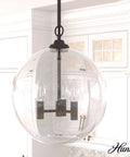 High Oaks 3-Light Noble Bronze Pendant Light With Dimmable Fixture, Dope Globe Seeded Glass Shades against kitchen backdrop