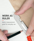 Using Titanium EDC Pry Bar Multitool With Dope Bottle Opener And Hex Wrench Ruler for measuring, showing gunmetal grey finish.